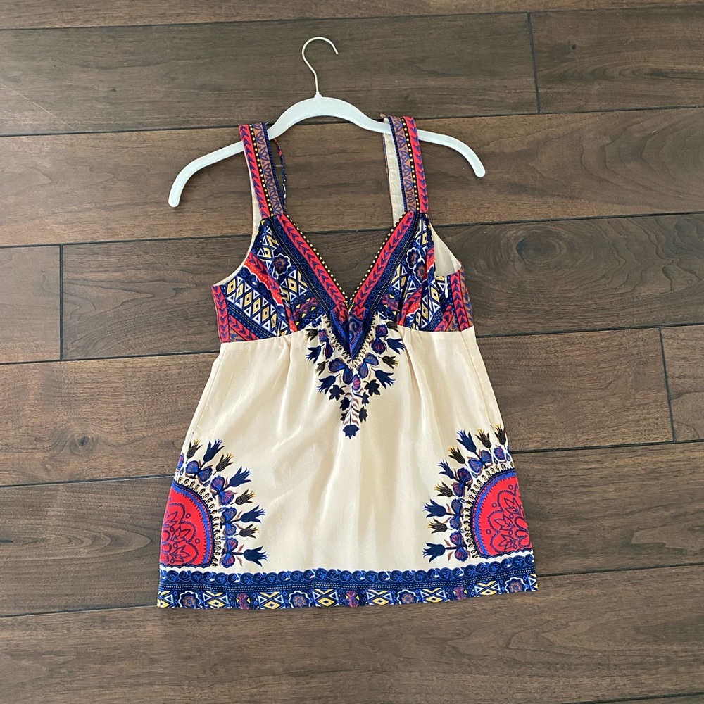 Tibi multicolored sleeveless silk blouse.